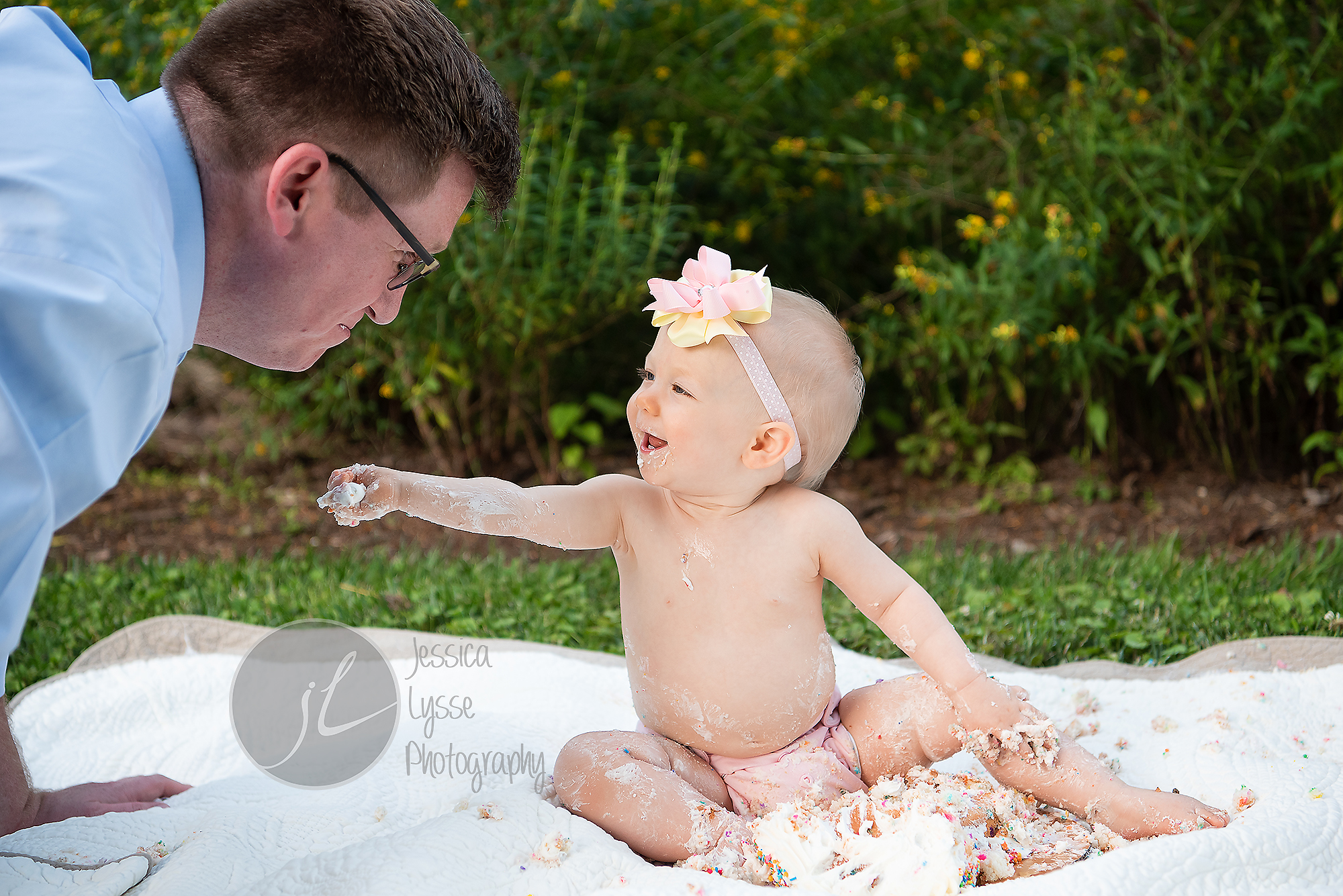 feeding Daddy her cake