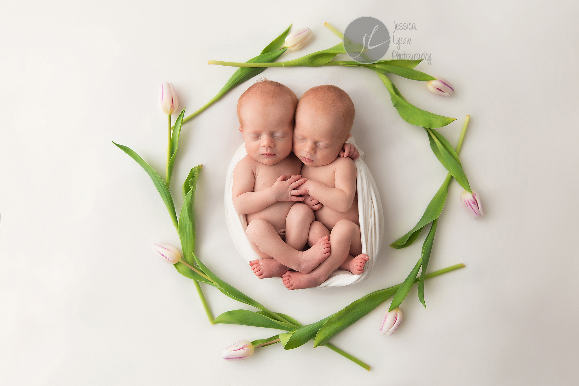 twins surrounded by tulips